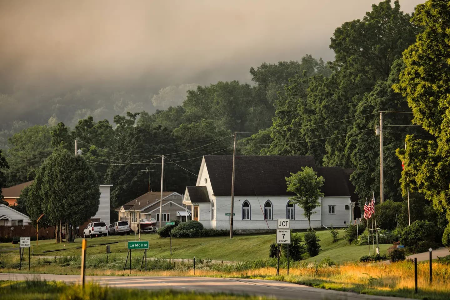 Illustrative scene, not evidence for this record: A foggy morning in the small town of Dakota, Minnesota.