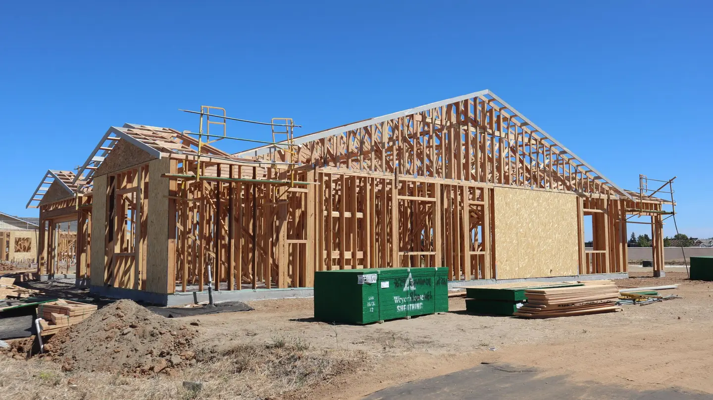 Illustrative scene, not evidence for this record: A house frame under construction.