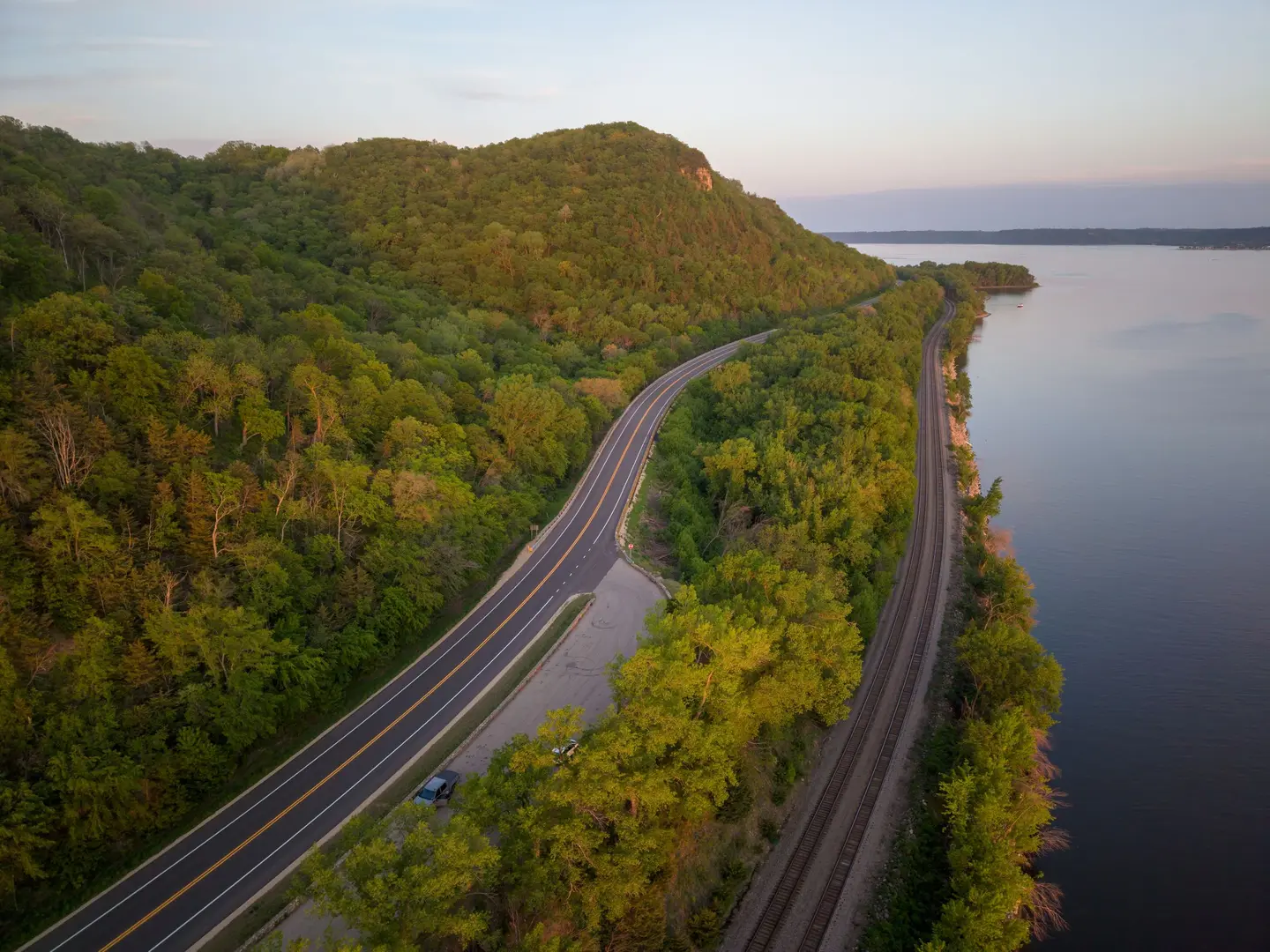 Illustrative scene, not evidence for this record: A highway and railway along the Mississippi at Maiden Rock, Wisconsin.