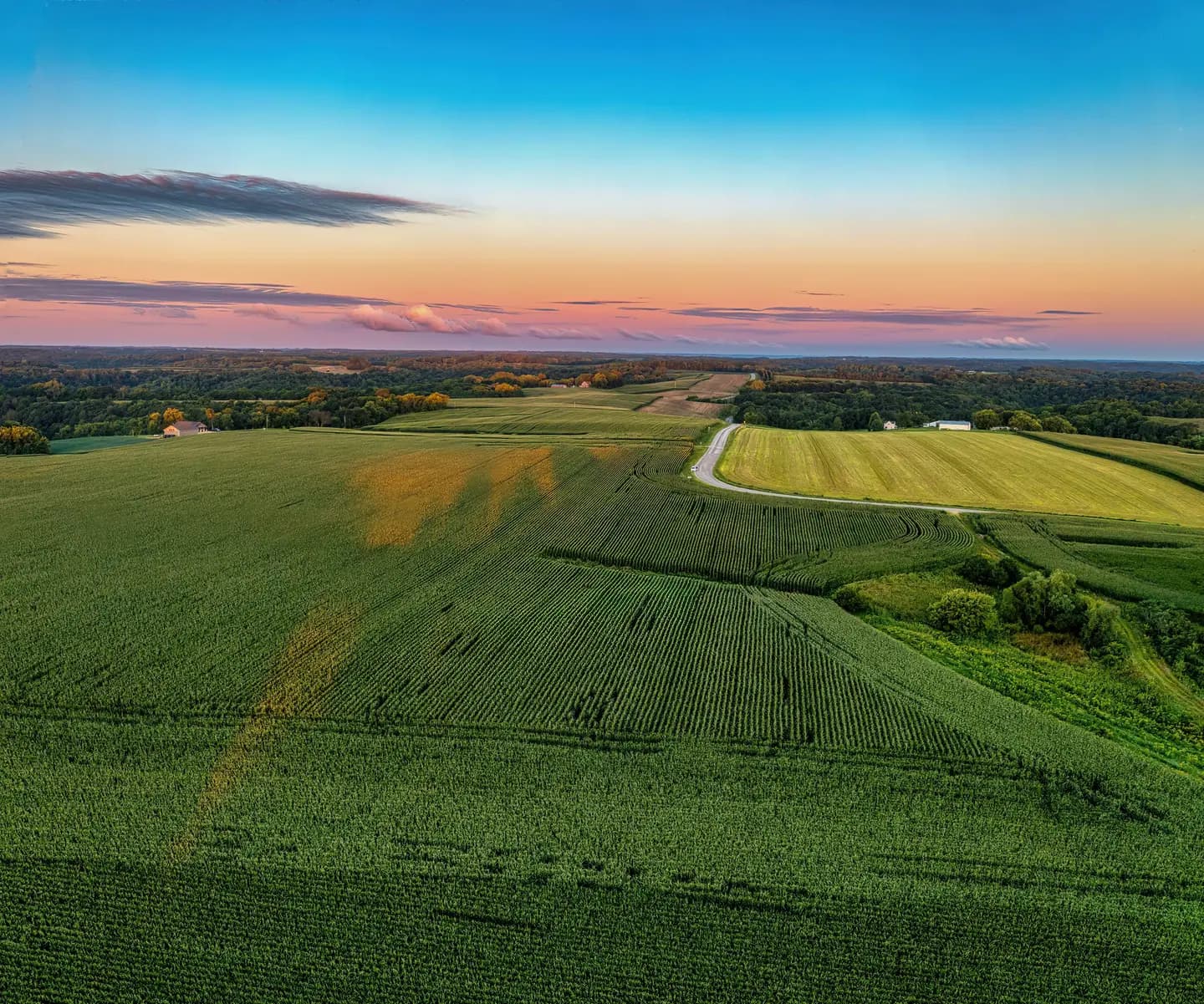 Illustrative scene, not evidence for this record: Farmland at sunset near Nelson, Wisconsin.