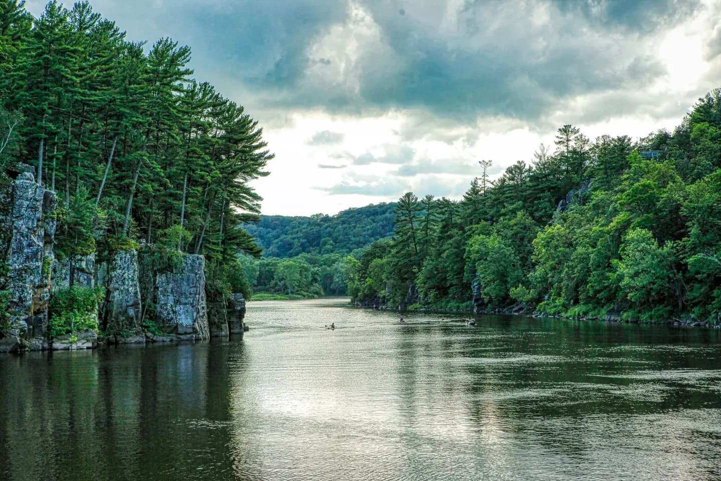 Illustrative scene, not evidence for this record: The St. Croix River below rock cliffs at St. Croix Falls, Wisconsin.