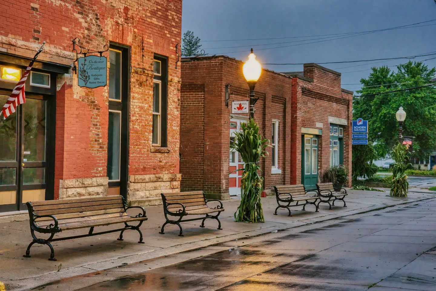 Illustrative scene, not evidence for this record: Benches beside brick storefronts in downtown Wabasha, Minnesota.