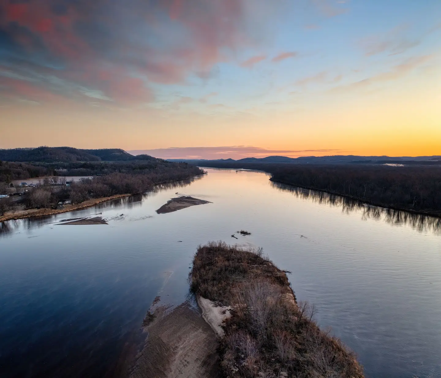 Illustrative scene, not evidence for this record: The Wisconsin River at sunset near Ella, Wisconsin.